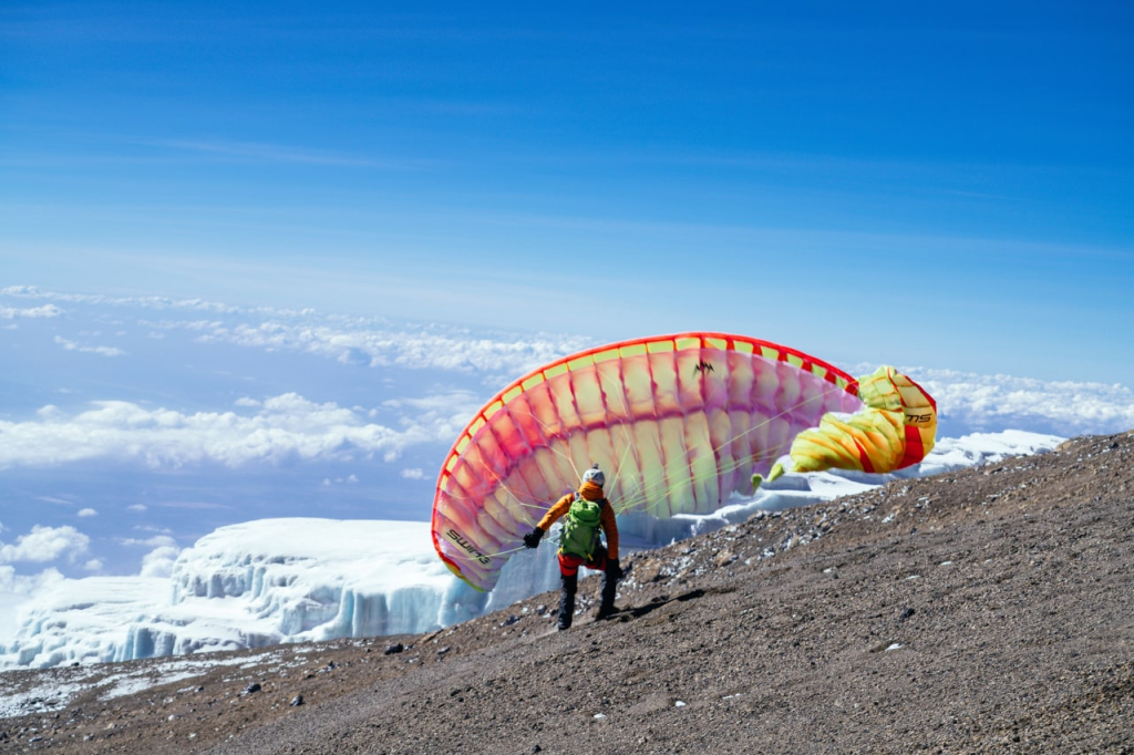  A paraglider pilot prepares to take off from Kilimanjaro. Sergey Shakuto, Altezza Travel, 2016
