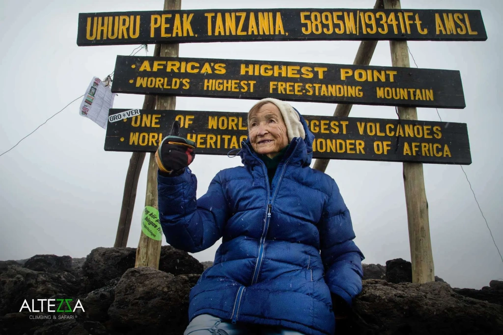 Angela on top of volcano Kilimanjaro, 5895 meters