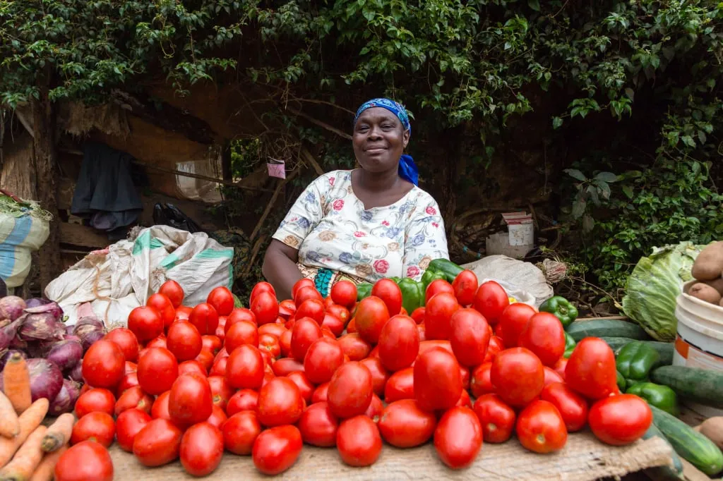 A lady selling fruit in the African market